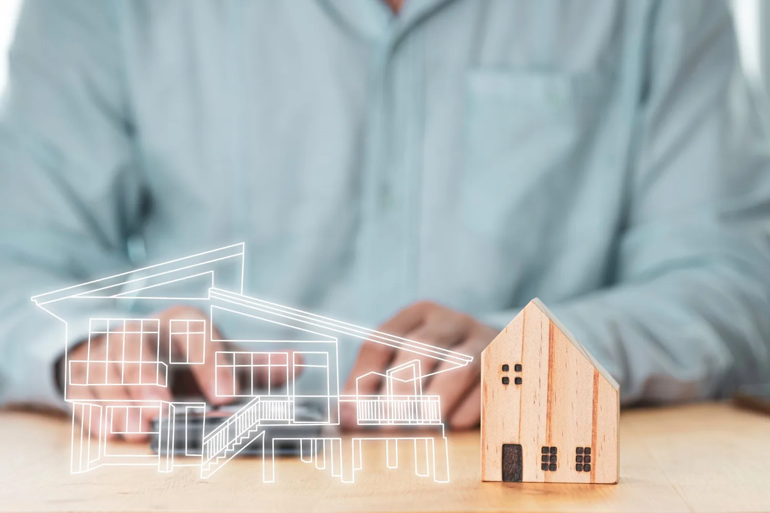 une réalisation en 3D d'un projet de construction de maison sur table